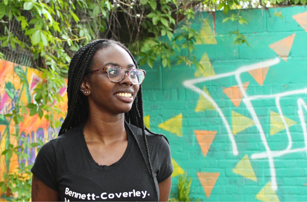 Jemmar wearing glasses and smiling