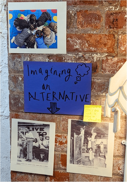 A blue sign on a brick wall