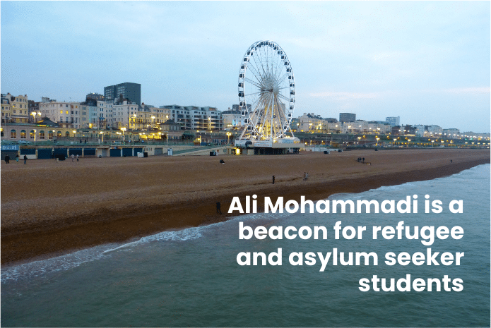 A ferris wheel on a beach Text - Ali Mohammad is a beacon for refugee and asylum seeker students