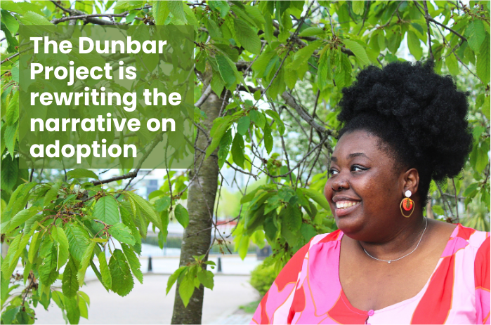 Shania-Sophia Dunbar Ives smiling in front of a tree. Text on screen - The Dunbar Project is rewriting the narrative on adoption.