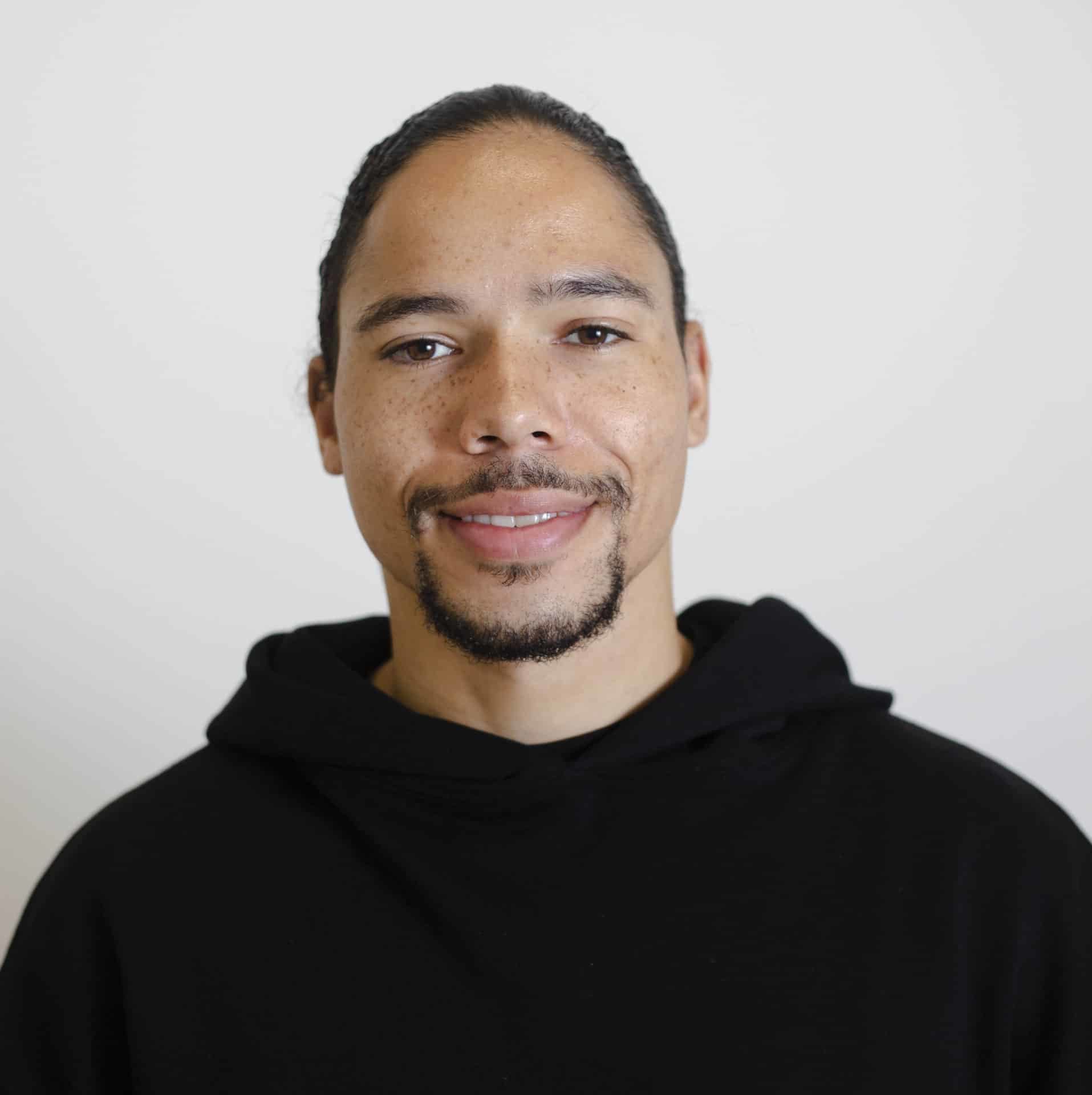 A man smiling at a camera