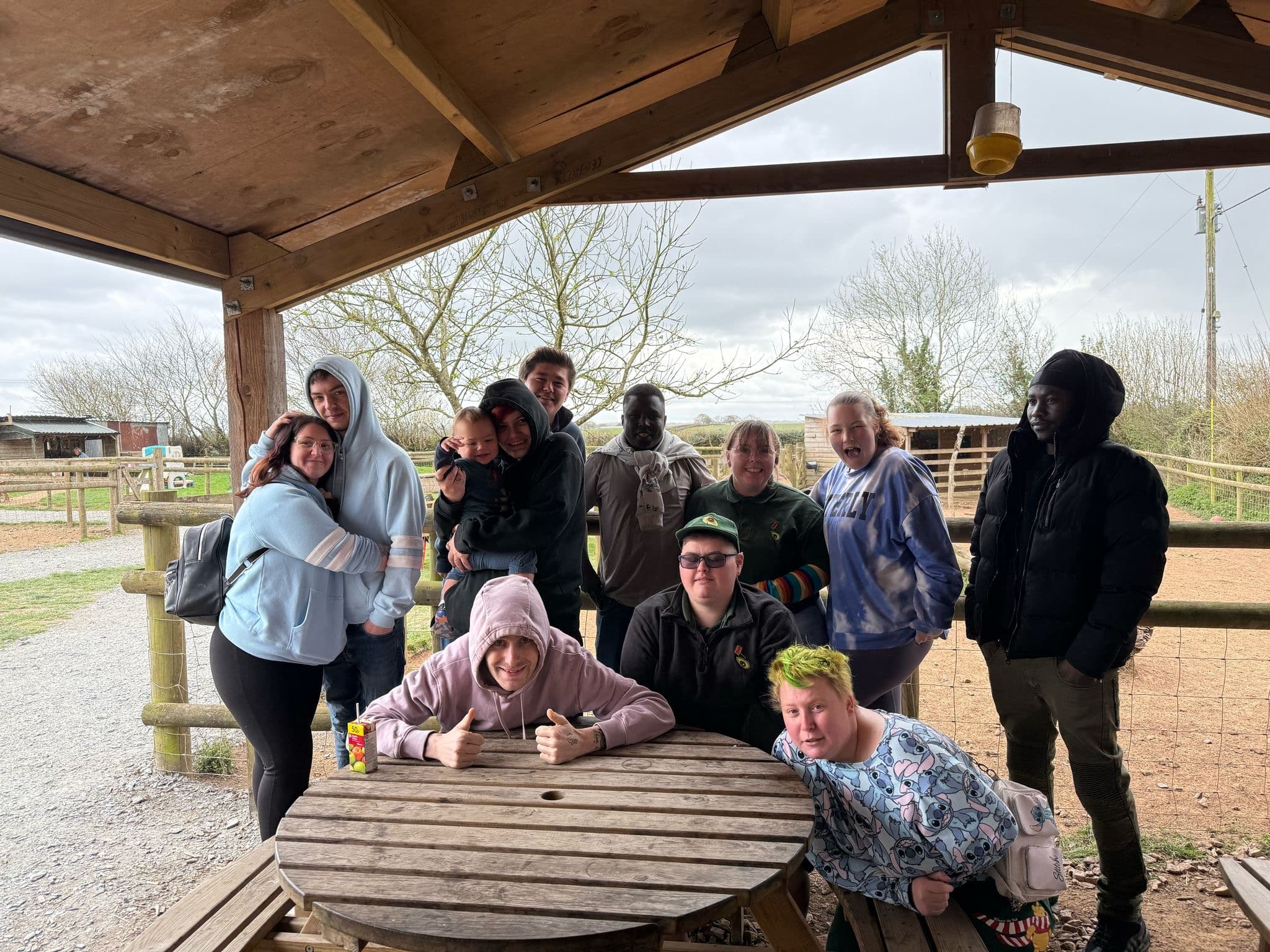 11 people taking a picture  outside together