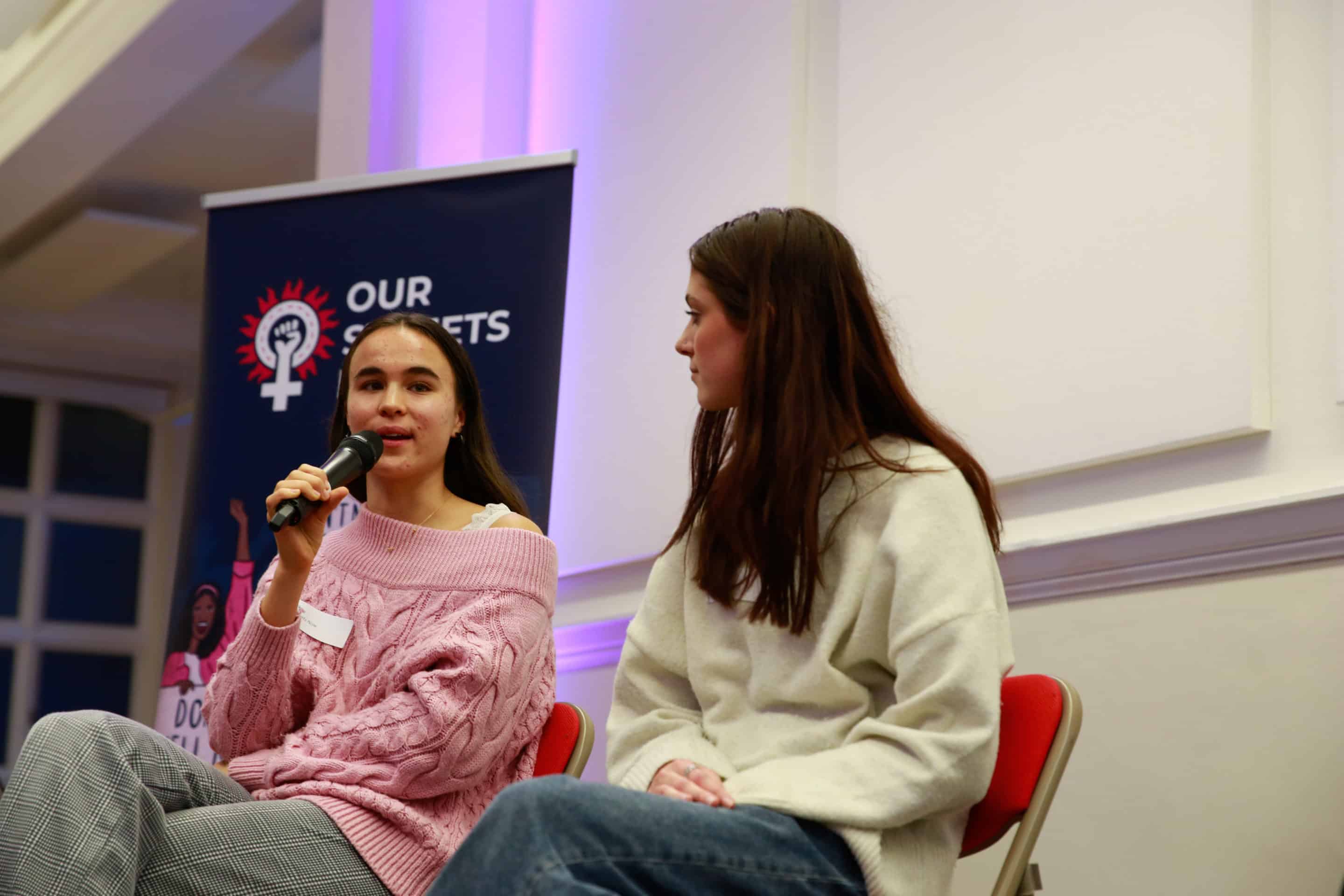 A person speaking into a microphone